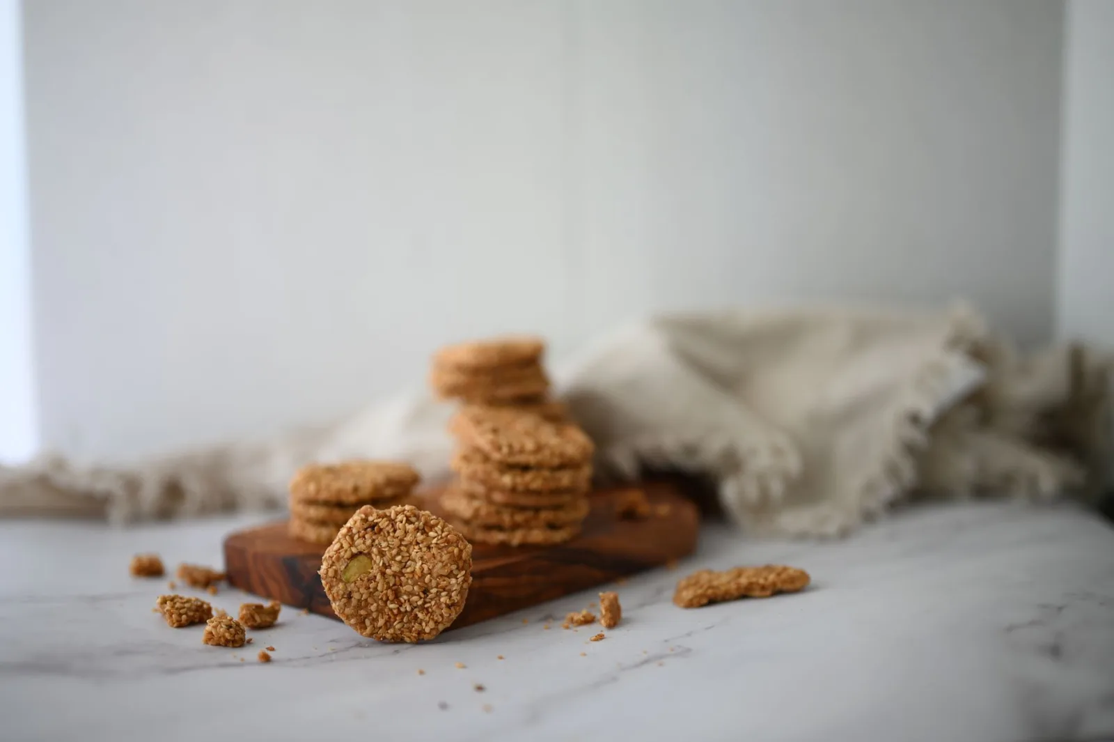 Stacked shortbread-style biscuits on a kitchen cloth