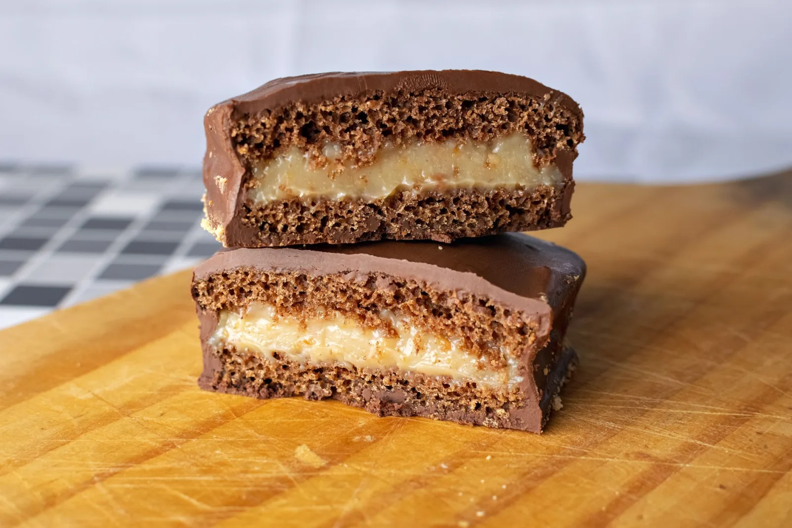 Layered chocolate and cream cake, cut into portions